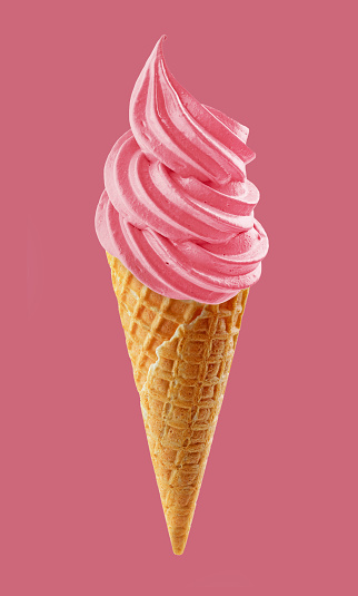 soft ice cream swirl in waffle cone isolated on pink background