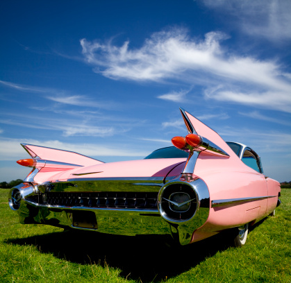 The classic pink 1959 Cadillac Coupe de Ville with her tail up. 