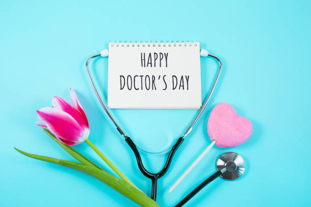 Pink tulip, candy and stethoscope on blue background. Pink tulip, candy and stethoscope on blue background. Happy nurse day. National Doctors day. womens health. flat lay top view, happy doctors day stock pictures, royalty-free photos & images