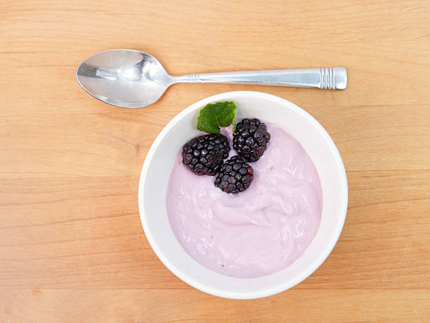 Pink yogurt with blackberries and Mint stock photo