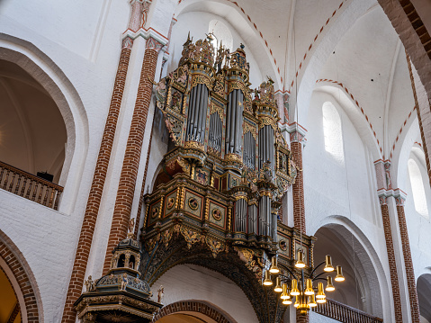 Beautiful old pipe organ from 1555 in Roskilde Cathedral. \nRoskilde Cathedral was opened in 1175 when Denmark was still catholic. With the reformation in 1536 Denmark became protestant. Most Danish kings and queens are buried in the cathedral, which is on the UNESCO World Heritage list.
