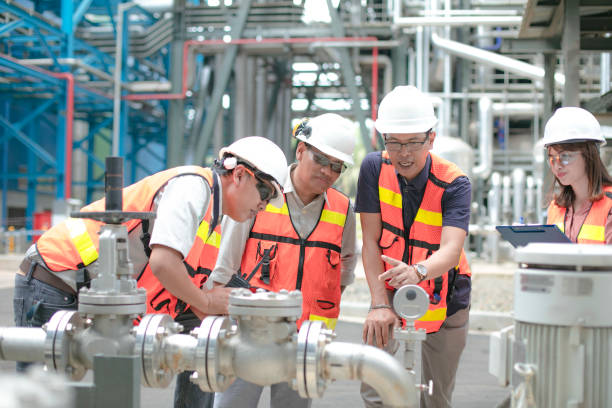 Pipelines, oil and engineer safety manager accompanied by his secretary and engineers conduct inspection oil refinery factory stock pictures, royalty-free photos & images