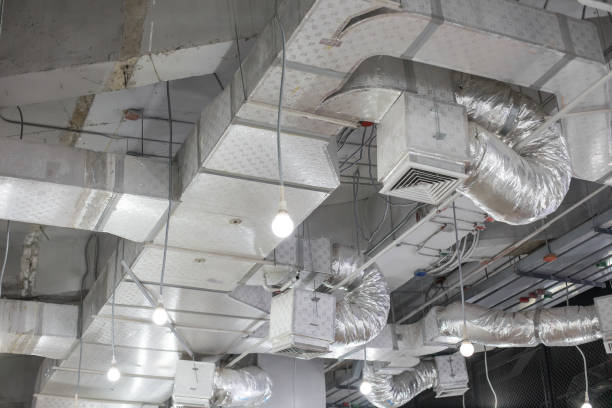 Pipes of air conditioning and ceiling electric system stock photo