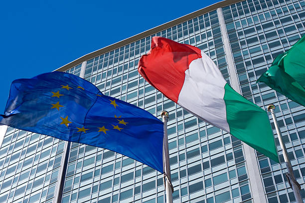 Pirellone skyscraper in Milan with Italian and European flags stock photo