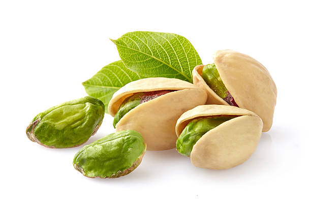 Pistachio nuts Pistachio nuts with leaf pistachio stock pictures, royalty-free photos & images