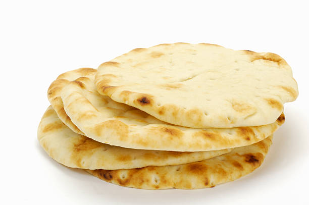 Pita Pita bread on white.  naan bread stock pictures, royalty-free photos & images
