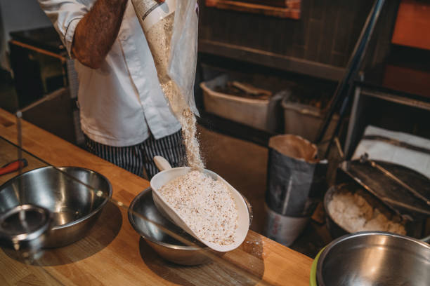 Pizza chef preparing the pizza dough with flour Pizza on a peel