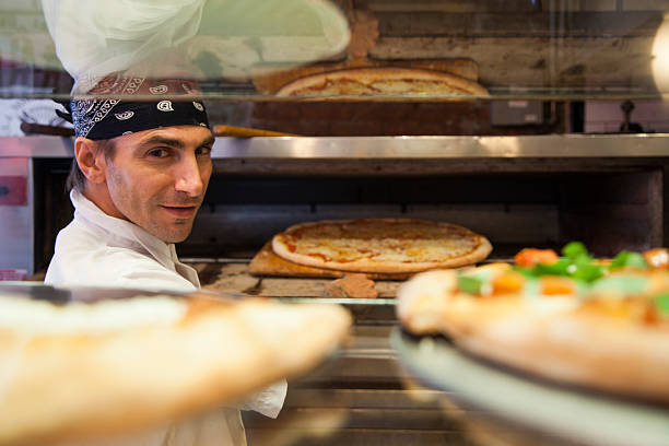 Pizza place chef Pizza place chef waiter taking order stock pictures, royalty-free photos & images