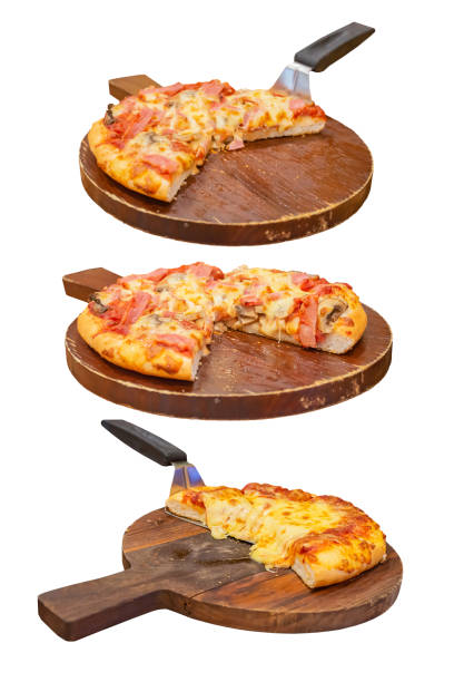Pizza with ham and cheese on the wooden tray is placed on a white background. stock photo