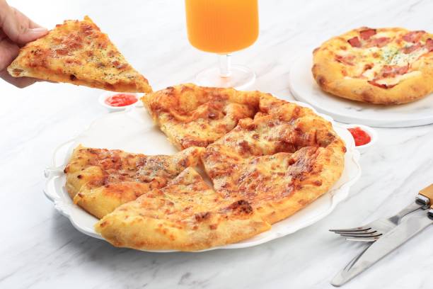 Pizza with Melted Cheese on Top, A Girl Take on Slice Pizza. Served on White Plate, Concept White Bakery stock photo
