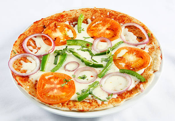 pizza without Fusion cuisine pizza dosa with tomatoes cheese adn green chillies thosai stock pictures, royalty-free photos & images