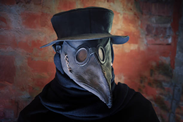 Plague mask, hat and costume of medieval Doctor. Plague mask, hat and costume of medieval Doctor. bubonic plague photos stock pictures, royalty-free photos & images