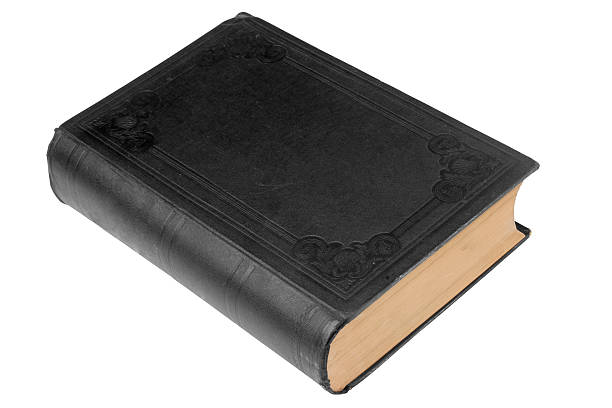 Plain black old bound book on white with path stock photo