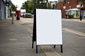 istock Plain white A-frame sign on a pavement in a residential area 1333383788