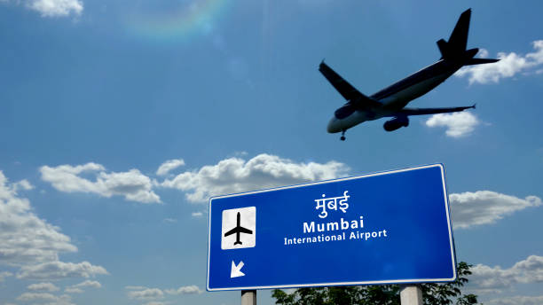 Plane landing in Mumbai, Bombay India, Maharashtra airport with signboard stock photo