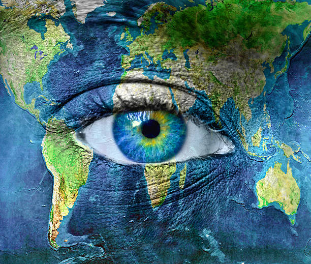Planet earth and blue human eye Planet earth and blue human eye - "Elements of this image furnished by NASA" person looking at map stock pictures, royalty-free photos & images
