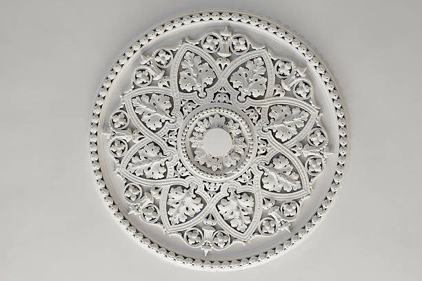 Plaster Ceiling Rose or plate Old antique plaster ceiling plate or rose in an old victorian house moulding trim stock pictures, royalty-free photos & images
