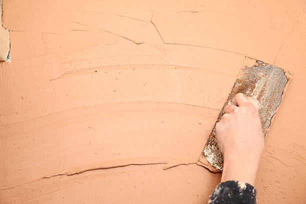 Plastering a wall stock photo