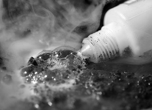Plastic bottle with spilled acid stock photo