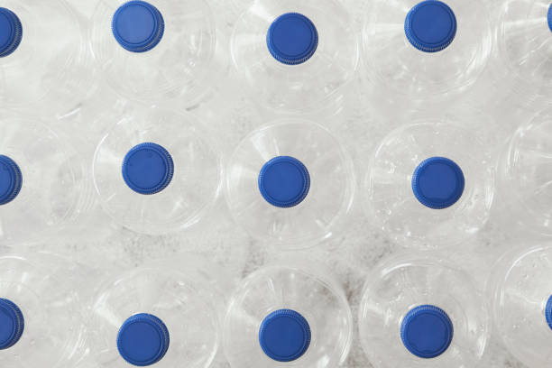 Plastic bottles with blue caps stock photo