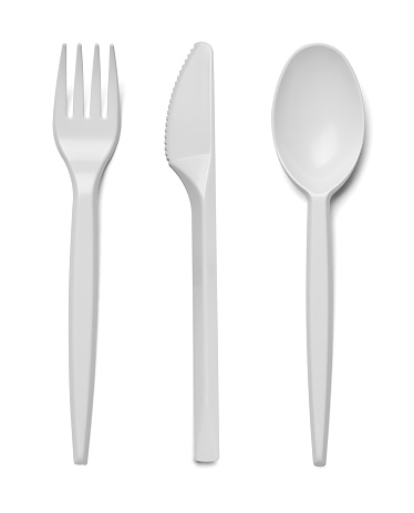 close up of plastic cutlery spoon, fork, knife on white background