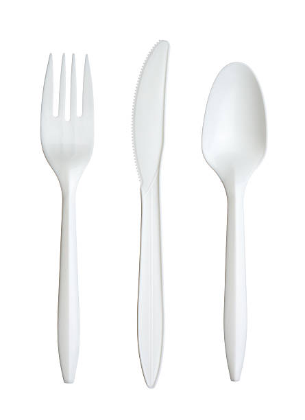 Plastic fork, knife, and spoon stock photo