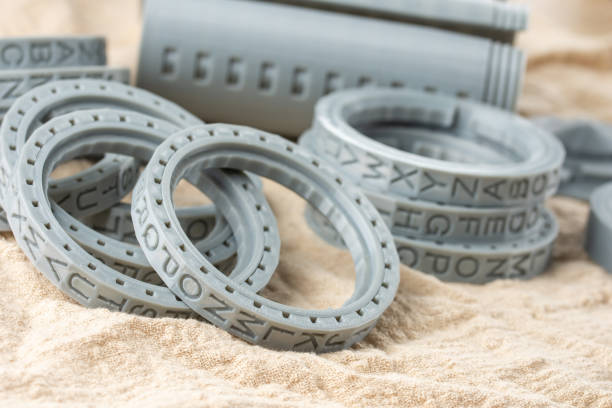 Plastic parts printed on a 3D printer, round letters rings. stock photo