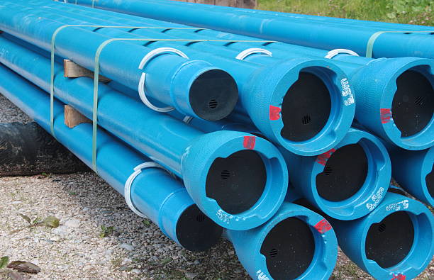 PVC plastic pipes for underground water supply and sewer lines stock photo