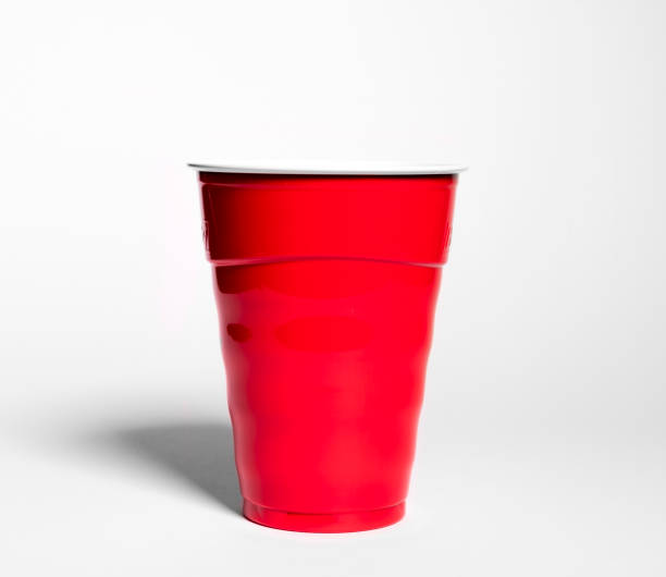 Plastic red cup on a white background stock photo