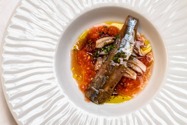 A plate of marinated sardines at seafood restaurant stock photo