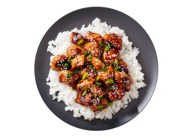 Plate of teriyaki chicken with rice isolated on white background stock photo