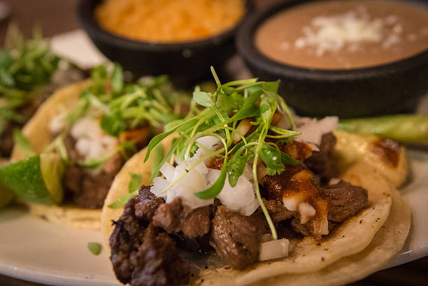 Plate of three street style tacos stock photo
