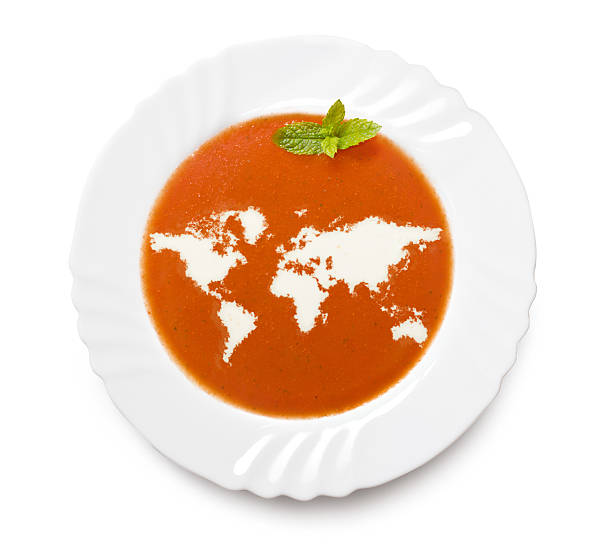 Plate tomato soup with cream (shape of the world) A plate tomato soup with cream in the shape of World.(series) spices of the world stock pictures, royalty-free photos & images