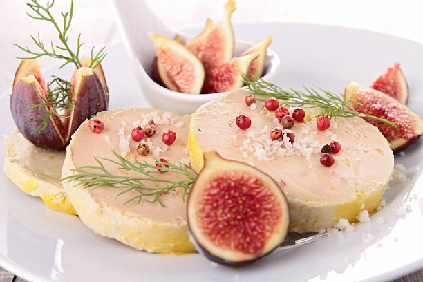 plate with foie gras and fresh fig plate with foie gras and fresh fig foie gras stock pictures, royalty-free photos & images