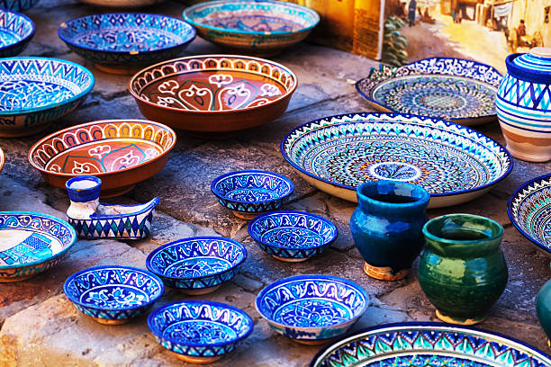 Plates and pots Plates and pots on a street market in the city of Bukhara, Uzbekistan bukhara stock pictures, royalty-free photos & images