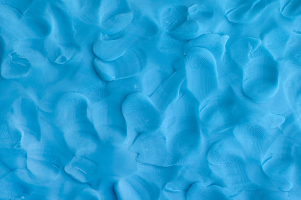 Play clay blue background texture Play clay blue background texture. Close up. clay stock pictures, royalty-free photos & images
