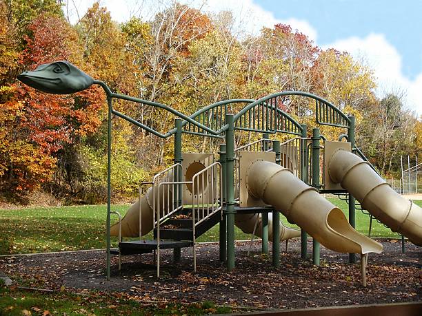 playground plesiosaur - dinosaur trees stockfoto's en -beelden