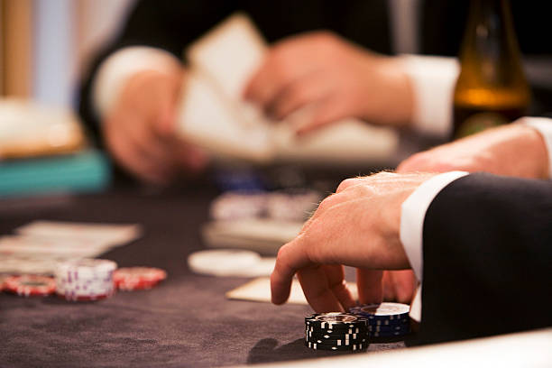 Playing poker at table gambling stock photo