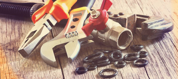 plumbing accessories  and tools closeup, horizontal header or banner, vintage faded colors toned plumbing accessories  and tools closeup, horizontal header or banner, vintage faded colors toned water pipe stock pictures, royalty-free photos & images