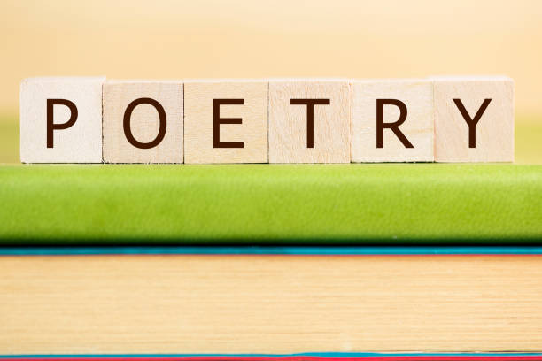 Poetry word made of wooden cubes on a desk stock photo