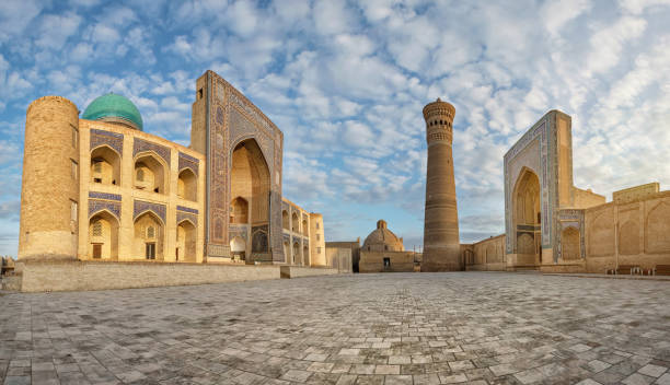 Poi Kalan - religious complex located around the Kalan minaret in Bukhara Panoramic view of Poi Kalan - an islamic religious complex located around the Kalan minaret in Bukhara, Uzbekistan bukhara stock pictures, royalty-free photos & images