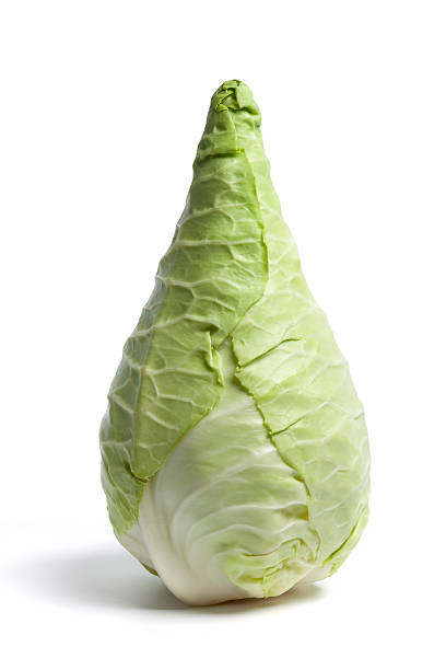 Pointed Cabbage on white background Pointed Cabbage, also known as the Hispi or Sweetheart cabbage spiked stock pictures, royalty-free photos & images
