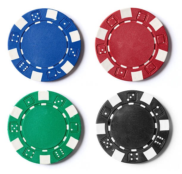 Poker Chips A picture of four different color poker chips on a white background. gambling chip stock pictures, royalty-free photos & images