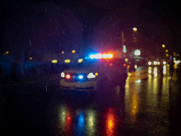 Police Car Lights Blurred Out of Focus on City Street stock photo