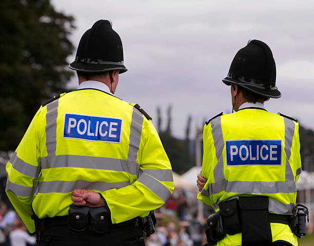 police men at summer fair showground - groot brittannië stockfoto's en -beelden
