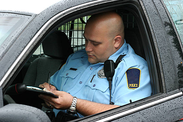 police-officer-writing-ticket-picture-id173611141