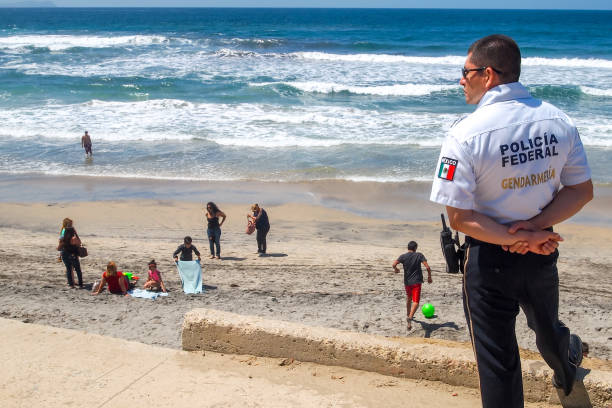 A policeman in Tijuana Beach on the Pacific Mexican Coast near the US-Mexico border stock photo