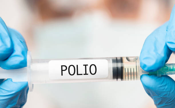 Polio Vaccine Doctor showing Polio Vaccine. polio stock pictures, royalty-free photos & images