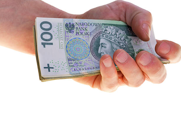 Polish currency banknotes hundred zloty stacked in hand. stock photo