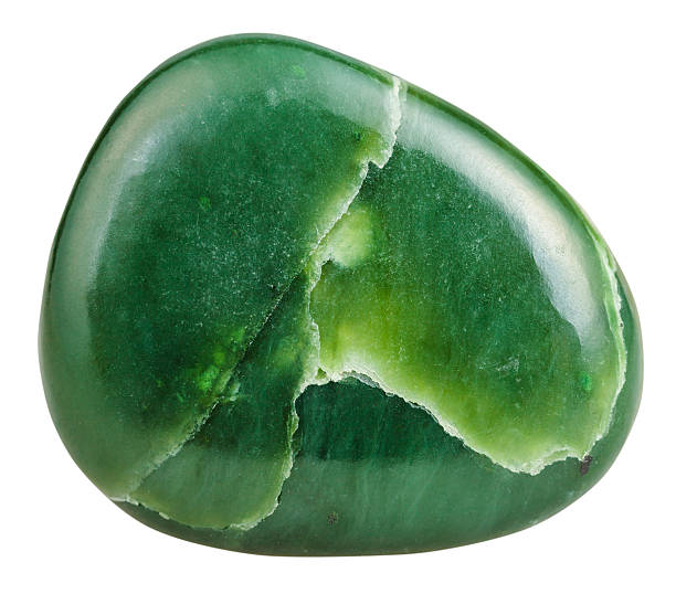 polished green Nephrite (jade) mineral gem stone macro shooting of natural gemstone - polished green Nephrite (jade) mineral gem stone isolated on white background stone object stock pictures, royalty-free photos & images